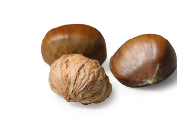 Three Edible Chestnuts on Minimalist White Background with Relieved Skin
