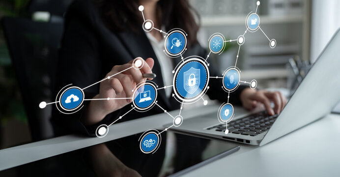 A business professional engages with technology, exploring cybersecurity measures with digital icons, emphasizing data protection in a modern workspace. Tessel - Powered by Adobe