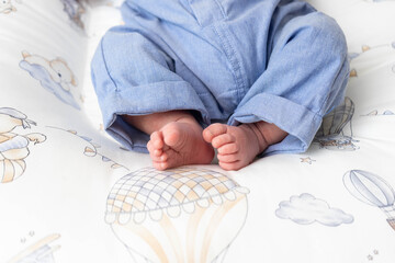 Close-up of baby’s tiny feet wrapped in a soft white towel after bath. Concept of newborn care, tenderness, and childhood innocence. Perfect for baby hygiene, love, and family themes.