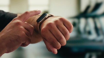 Smart watch using in gym, Close up of woman hands im gym checking incoming notification on smart watch. Incoming text message received on app smartwatch. Social media networking technology concept. - Powered by Adobe