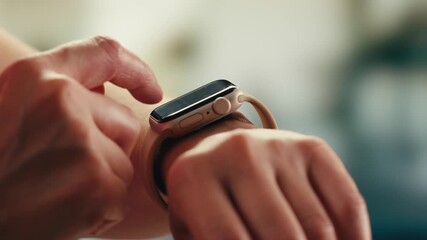 Smart watch using in gym, Close up of woman hands im gym checking incoming notification on smart watch. Incoming text message received on app smartwatch. Social media networking technology concept. - Powered by Adobe