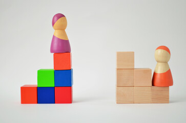 People figurines on unequal career path steps