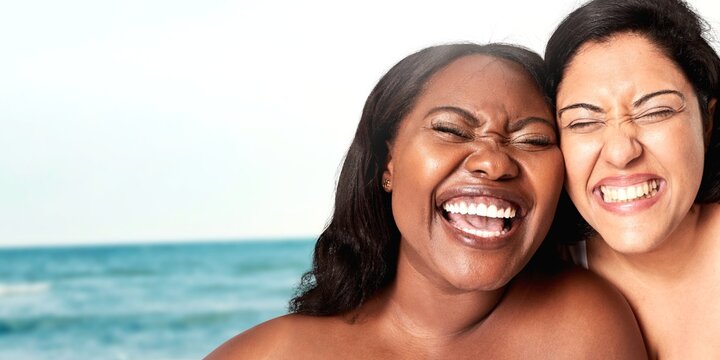 Body positivity women laughing happy plus size model posing