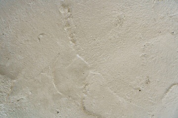 Footprints on a sandy surface showing signs of recent activity near the beach