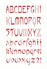 Hand-drawn alphabet created with ink and pen. Decorative red lettering in artistic calligraphic style on white background.