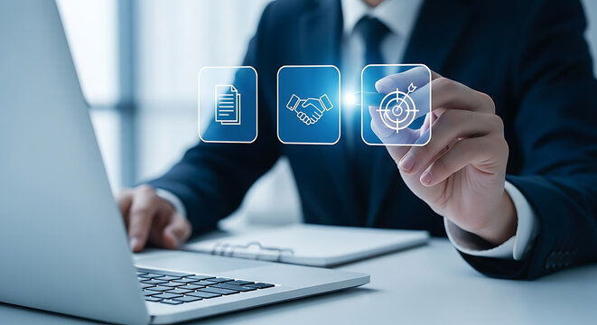 Businessman using digital interface to select goals, agreements and documentation, while working on laptop in modern office