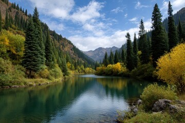 A serene lake reflecting the sky surrounded by dense evergreen forests and distant mountains