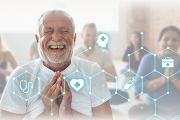 Smiling old man in yoga class