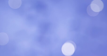 gold shiny christmas lights glowing on blue festive background