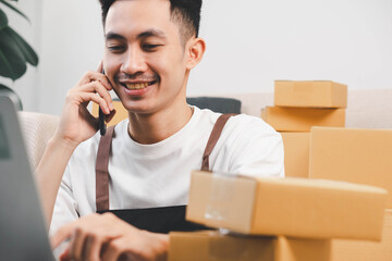 Startup small business owner packing boxes for online customer delivery. Entrepreneur managing e-commerce orders, shipping parcels, and running home-based business operations from home office.