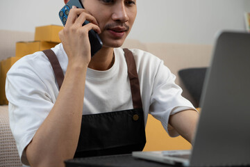 Startup small business owner packing boxes for online customer delivery. Entrepreneur managing e-commerce orders, shipping parcels, and running home-based business operations from home office.