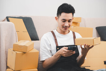 Startup small business owner packing boxes for online customer delivery. Entrepreneur managing e-commerce orders, shipping parcels, and running home-based business operations from home office.
