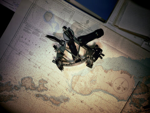 Nautical chart of Unimak and Akutan Pass, Alaska, with marine sextant.