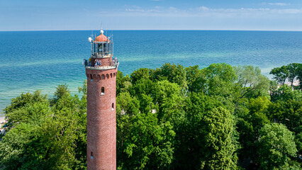 Lighthouse by Baltic sea in Poland. Tourism at Baltic Sea