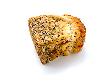Sliced multigrain bread topped with pumpkin seeds, sunflower seeds, sesame, and black sesame.