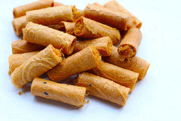 Rolled crispy wafers filled with shredded pork floss, Thai snack.