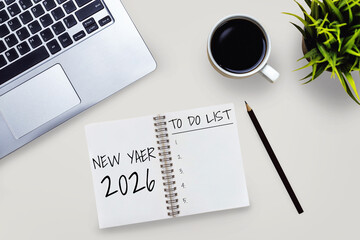 2026 Happy New Year Resolution Goal List and Plans Setting - Business office desk with notebook written about plan listing of new year goals and resolutions setting. Change and glee concept.
