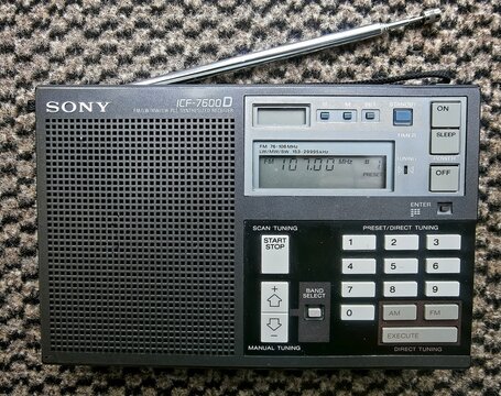 Lincolnshire UK. June 2017: Retro 1980s SONY ICF-7600D 4 band radio on textile background