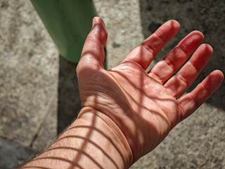 Open hand reaching out in Seville, Andalusia, Spain