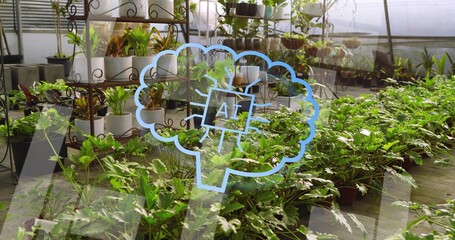 Displaying foreground bed of leafy potted plants in greenhouse, showing blue AI brain overlay