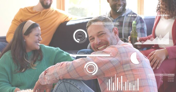 Smiling man in plaid shirt leaning forward in living room, with popcorn bowl and HUD graphics - Powered by Adobe