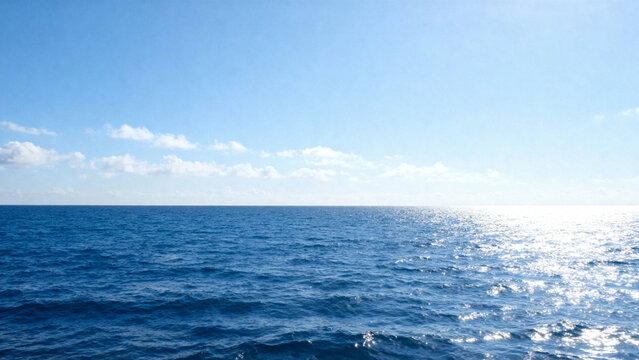 Calming ocean view under a clear blue sky with sunlight reflecting on the water surface - Powered by Adobe