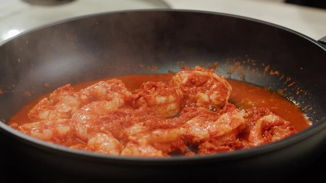 Tamarind red prawn curry cooking, shrimps in tomato ginger sauce, asian kitchen, Chinese restaurant.