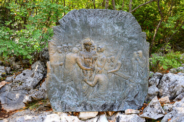 Station X: Jesus is stripped of his garments (Division of robes). The Way of the Cross on Mount Križevac (the Cross Mountain) in Medjugorje.