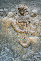 Station X: Jesus is stripped of his garments (Division of robes). The Way of the Cross on Mount Križevac (the Cross Mountain) in Medjugorje.