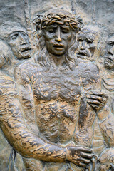 Station X: Jesus is stripped of his garments (Division of robes). The Way of the Cross on Mount Križevac (the Cross Mountain) in Medjugorje.