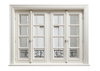 White, ornate window with shutters