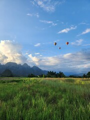 Sunset Over Green Rice Fields and Limestone Mountains in Vang Vieng Laos