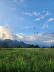 Sunset Over Green Rice Fields and Limestone Mountains in Vang Vieng Laos