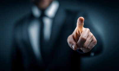 Business professional in suit pressing invisible screen with index finger.