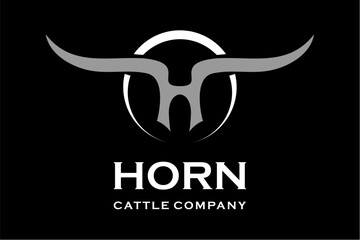 Fototapeta premium Stylized Bull Horns Logo with Company Name Horn Cattle Company.