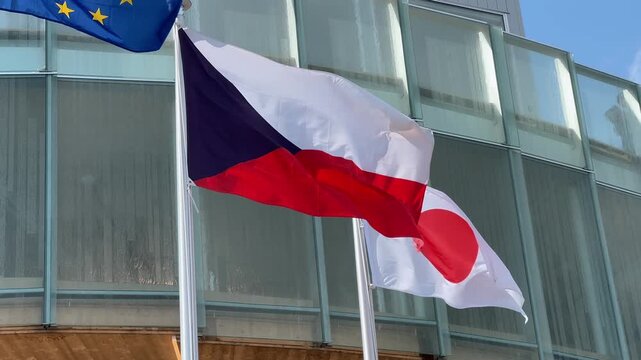 Flags of Czechia, Japan, and the European Union (EU) wave gracefully in the spring breeze during Expo 2025 in Osaka, symbolizing unity, diplomacy, and global cooperation.