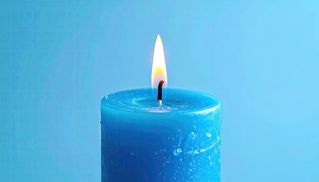 Blue candle flame glows against a plain blue backdrop