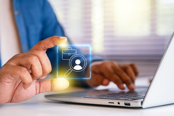 Job search recruitment hiring concept, magnifying glass profile and business hand, human resources professional analyzing candidate on laptop computer, HR modern technology, virtual job search icon
