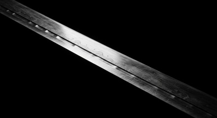 Fototapeta premium Monochrome sharpness: Capturing the detail and texture of a traditional katana blade