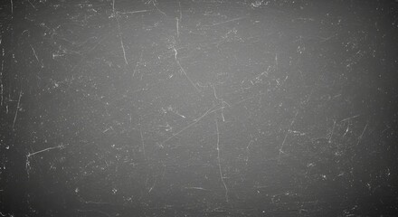 Dusty blackboard or chalkboard texture with light scratches and imperfections for backgrounds and overlays