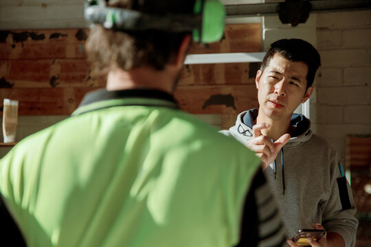 Home owner discussing plans with a tradie builder