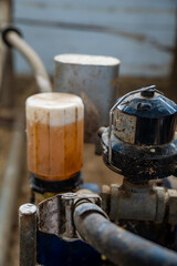 Milking machine for the first milking of a cow on a farm