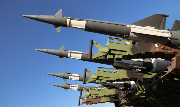 Array Of Military ballistic atomic rockets Multiple Missiles Against Blue Sky Displaying War Defense Technology Military missile launch system: defense and power. Soviet Union Russian Anti aircraft