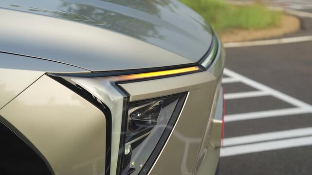 Closeup shot of head light of car with drl's.