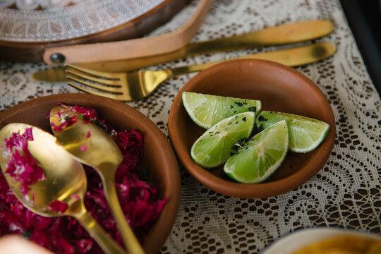 Horizontal shot of fresh lime in a small bowl on a table