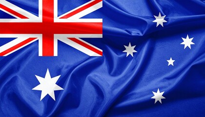 "Australian flag flying against blue sky — Union Jack, Commonwealth Star, and Southern Cross on deep blue field, symbolizing heritage, federation, and southern identity"