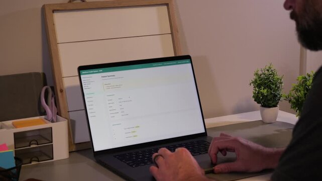 Middle Aged Man Checking His Electronic Medical Records - EMR at Home Concept