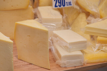 Fresh cheese selection displayed at local market stall