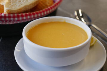 Delicious creamy soup served with bread at a restaurant