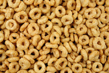 Wholegrain breakfast cereal hoops detail background texture
